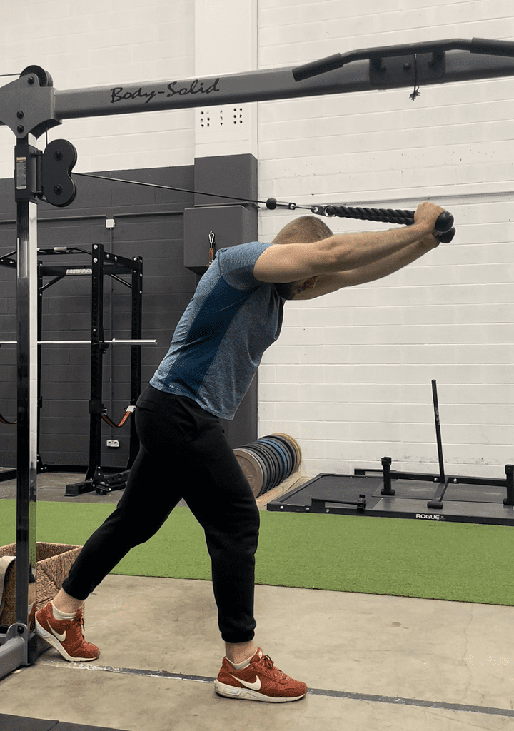 aleksander saks performing overhead triceps extensions