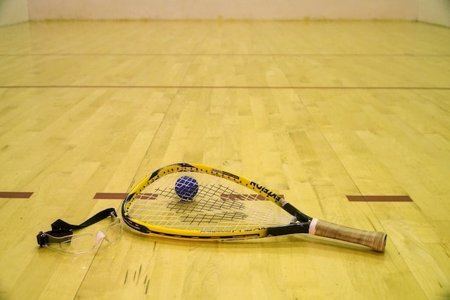 a racquetball racket and ball